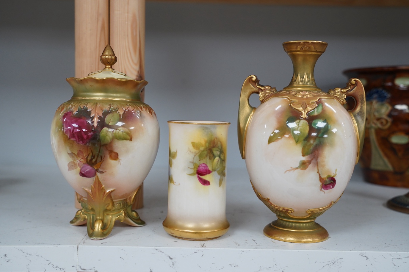 Three Royal Worcester rose painted vases, numbers 1684, 245 and 2510, tallest 18cm. Condition - good